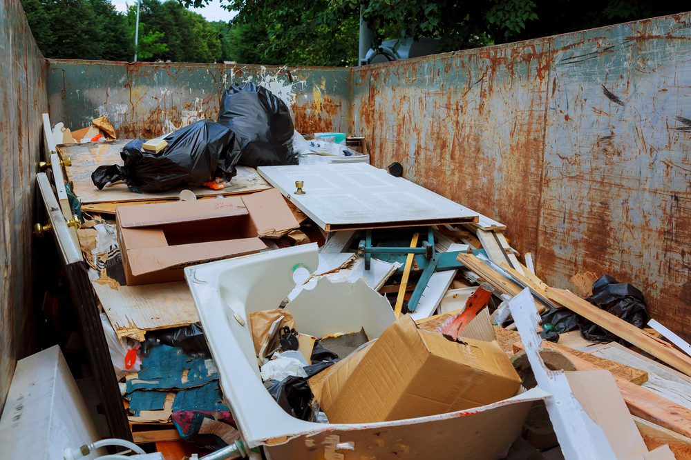 large dumpster full of junk removed by a junk removal company